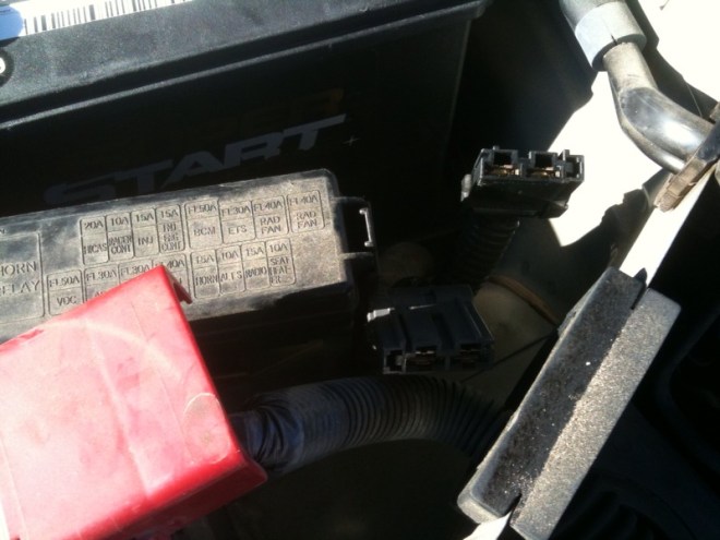 Step 4 - Both plugs have been removed and the main terminal is moved to the side